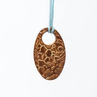 Oval Pottery Necklace with Engraved Floral Motifs