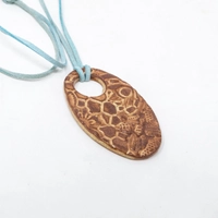 Oval Pottery Necklace with Engraved Floral Motifs