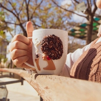 White Ceramic Mug with Polymer Clay Decoration of a Woman & Coffee Beans