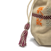 Beige wallet embroidered with brown, white, green and orange threads