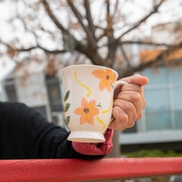 Handcrafted Clay Mug Painted with Colorful Floral Designs 