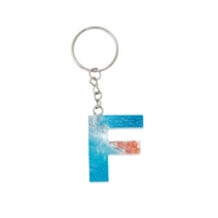 Resin Keychain with Blue Glitter and Peach Fried Flowers in the Shape of the Letter F