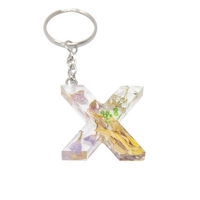 Resin Keychain with Dried Colorful Flowers in the Shape of the Letter X