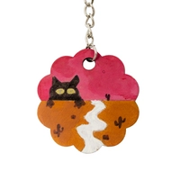 Cute Keychain in The Shape of a Flower Adorned with a Drawing of a Cat