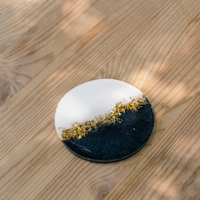 Round Resin Coaster in Black and White with Shiny Golden Glitters