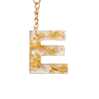 Handmade Transparent Resin Keychain in the Shape of the Letter E with Golden Sparkles