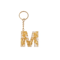 Initial Keychain letter M - Made of Transparent Resin with Shiny Golden Pieces 