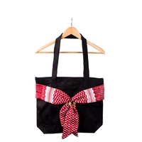 Medium Sized Black Handbag Decorated with a Traditional Red Shemagh