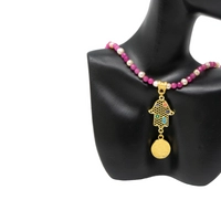 Handmade Fuchsia Beaded Necklace with a Golden Hamsa Hand Pendant