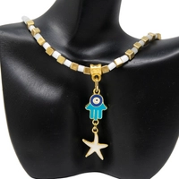 White and Gold Beaded Necklace with Hamsa Pendant and A Golden Star