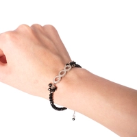 Black Beads Bracelet Decorated with Shiny Circular Pieces of Silver