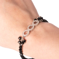 Black Beads Bracelet Decorated with Shiny Circular Pieces of Silver