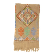 A beige shoulder scarf hand-embroidered with traditional patterns and vibrant colors