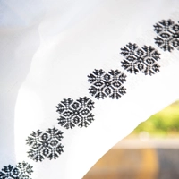 Wide White Scarf Decorated on the Edges with Black Embroidery Patterns