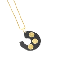 Distinctive Gold Necklace: A Thin Gold Chain with A Black Spiral Pendant