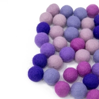 Colorful wool balls used with a wooden board game to teach children how to count! - Wool Balls Blue