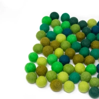 Colorful wool balls used with a wooden board game to teach children how to count! - Wool Balls Blue