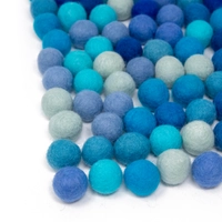 Colorful wool balls used with a wooden board game to teach children how to count! - Wool Balls Blue