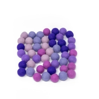 Colorful wool balls used with a wooden board game to teach children how to count! - Wool Balls Blue