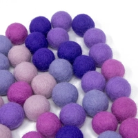 Colorful wool balls used with a wooden board game to teach children how to count! - Wool Balls Blue