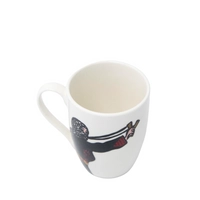 White ceramic mug with the drawing of a Palestinian woman fighting for her land