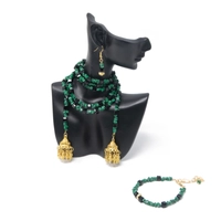 Elegant Accessory Set Consisting of Earring, Necklace , and two Bracelets Handcrafted from Green and Black Stones