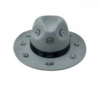 Women's gray fedora hat designed with a black satin ribbon and small eye patches