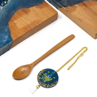 Set of Wooden Cheese Plater with a Wooden Spoon and a coffeepot chain.