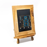 A wooden frame embroidered from the inside in the shape of a dress - purple color