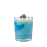 Candle in a Glass Decorated with Seashells, Evoking Calm Coastal Vibes
