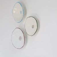 Porcelain Saucers in Blue, Maroon, and Green