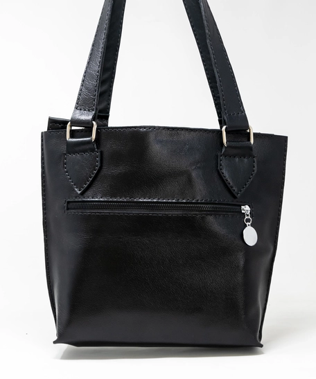 حقيبة يد جلد طبيعي لون أسود - فستان أزرق