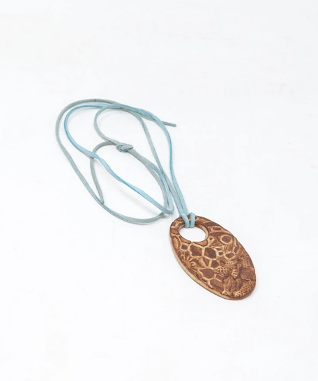 Oval Pottery Necklace with Engraved Floral Motifs