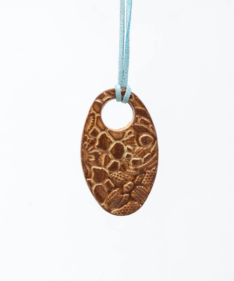 Oval Pottery Necklace with Engraved Floral Motifs