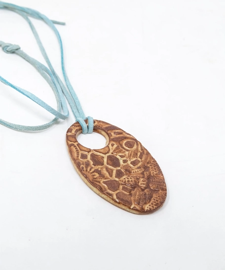 Oval Pottery Necklace with Engraved Floral Motifs