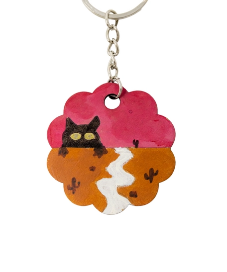 Cute Keychain in The Shape of a Flower Adorned with a Drawing of a Cat