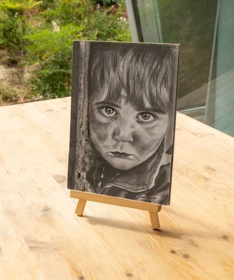 Pencil Drawing of a Child's Portrait with Artistic Precision and Realistic Details