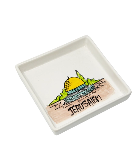 A square white dish decorated with an elaborate hand-painted drawing of the city of Jerusalem and the Dome of the Rock