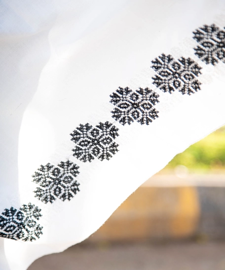 Wide White Scarf Decorated on the Edges with Black Embroidery Patterns