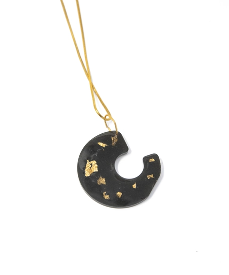 Distinctive Gold Necklace: A Thin Gold Chain with A Black Spiral Pendant