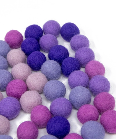 Colorful wool balls used with a wooden board game to teach children how to count! - Wool Balls Blue