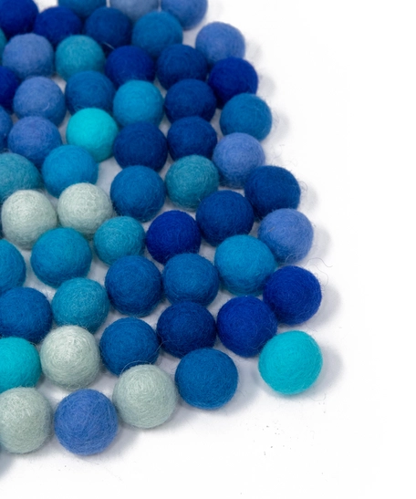 Colorful wool balls used with a wooden board game to teach children how to count! - Wool Balls Blue