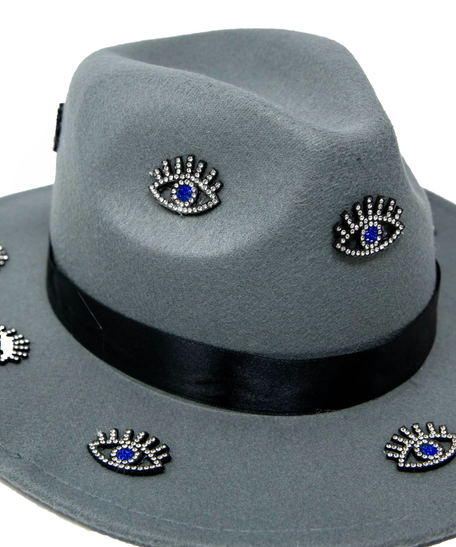 Women's gray fedora hat designed with a black satin ribbon and small eye patches