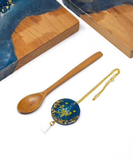 Set of Wooden Cheese Plater with a Wooden Spoon and a coffeepot chain.