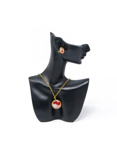 A stylish accessories set with red rose in resin and metal - necklace and earrings in red color.