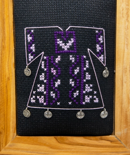 A wooden frame embroidered from the inside in the shape of a dress - purple color